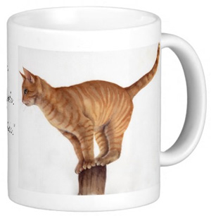 Ginger Cat Balancing on Mug